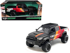 2023 Toyota Tacoma TRD PRO Off Road Pickup Truck Matt Black with Graphics and Roofrack "Maisto Design" Series 1/27 Diecast Model Car by Maisto - View 1